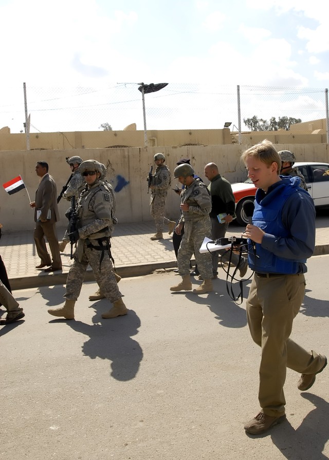 Mike Sergeant (blue vest), of the British Broadcasting Company, speaks into his voice recorder during the Sulla Media Day, March 2, hosted by the 1st Combined Arms Battalion, 18th Infantry Regiment, 2nd Heavy Brigade Combat Team, 1st Infantry Divisio...