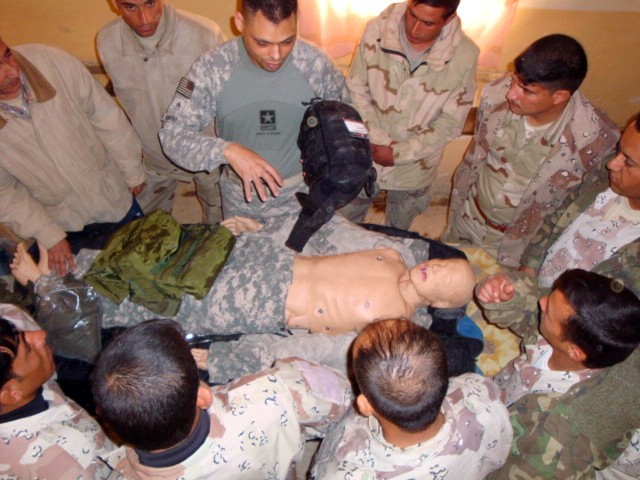Staff Sgt. Michael Rosado, from the 27th Brigade Support Battalion, 4th Brigade Combat Team, 1st Cavalry Division, explains how to use the new combat life saver bag during a medical class with troops from the 10th Motorized Transportation Unit, 10th ...