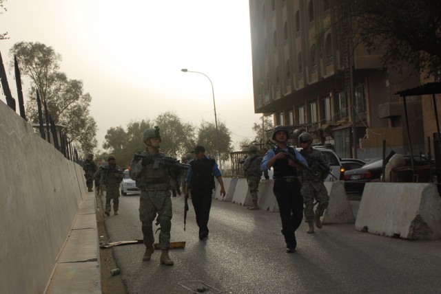 BAGHDAD - Spc. Zachery Hughes, a team leader, and Pfc. Michael Shuster, a cavalry scout, both assigned to Troop B, 5th Squadron, 73rd Cavalry Regiment, 3rd Brigade Combat Team, 82nd Airborne Division, lead a joint security patrol with their Iraqi...