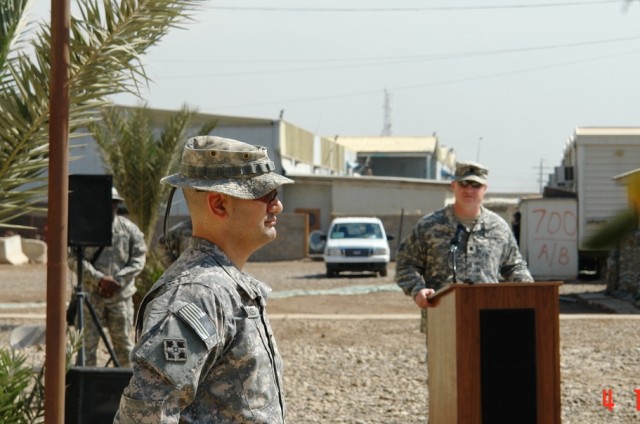 BAGHDAD- El Paso, Texas native, Lt. Col. Rich Morales (left), commander, Task Force 1st Battalion, 35th Armor Regiment, 2nd Brigade Combat Team, 1st Armored Division, Multi-National Division-Baghdad, listens as Lt. Col. Matthew Elledge, commander,...