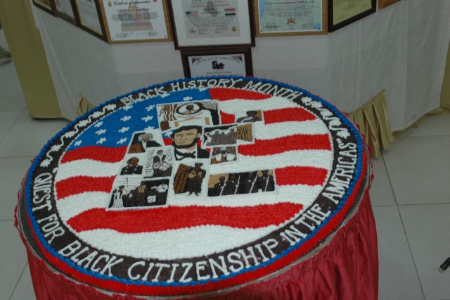 A cake specially decorated by staff of the FOB Diamondback dining facility, in honor of Black History Month, is placed prominently near the entrance to the serving line during the black history celebration held at the FOB Diamondback dining facility ...