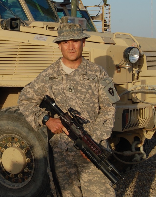 CAMP LIBERTY, Iraq - Brownsville, Texas native Sgt. 1st Class Glenn Sierra is pictured in front of a route clearance vehicle. Sierra is the platoon sergeant for the 1st Platoon "Reapers" of the 836th Sapper Company out of Kingsville, Texas. The 836th...