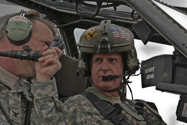On the flight line of 1st Attack Reconnaissance Battalion, 227th Avaition Regiment, 1st Air Cavalry Brigade, 1st Cavalry Division, Colonel Douglas Gabram from Cleveland, commander of the 1st ACB, gives the III Corps Command Sergeant Major Neil...