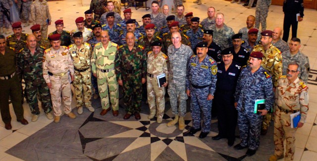 BAGHDAD-Senior Iraqi Army commanders and key Multi-National Division-Baghdad staff members gather together for a photo-op at the conclusion of the Baghdad Commanders Conference March 12.  The meeting afforded both forces the opportunity to frame a co...