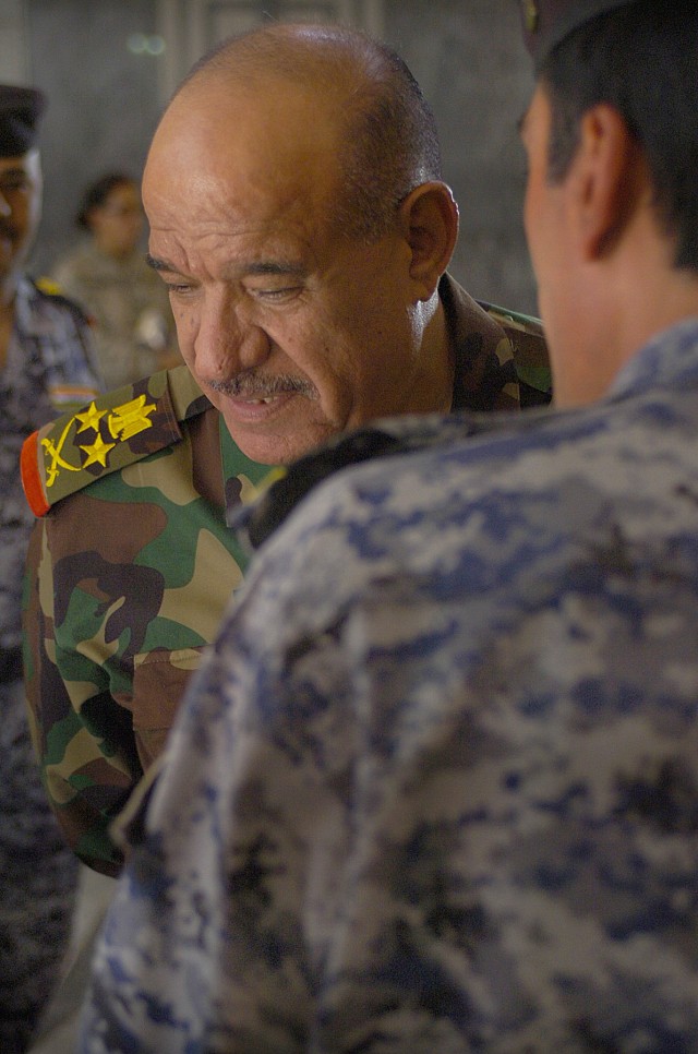 BAGHDAD-Iraq Army Commander, Gen Abbud Qanbar al-Maliki, visits with his senior commanders following the Commanders Conference held at the Baghdad Operations Center March 12. Abbud addressed both Iraqi and American leaders before the conference echoi...