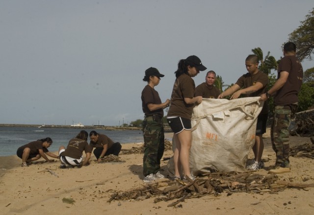 Soldiers and cadets work together to clean up beach