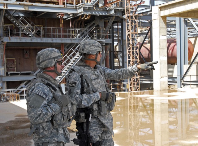 BAGHDAD - Brig. Gen. Frederick Rudesheim (right), deputy commanding general for support, 1st Cavalry Division and Multi National Division-Baghdad, speaks with Lt. Col. Jim Bradford, commander, 1st Combined Arms Battalion, 63rd Armor Regiment, at...