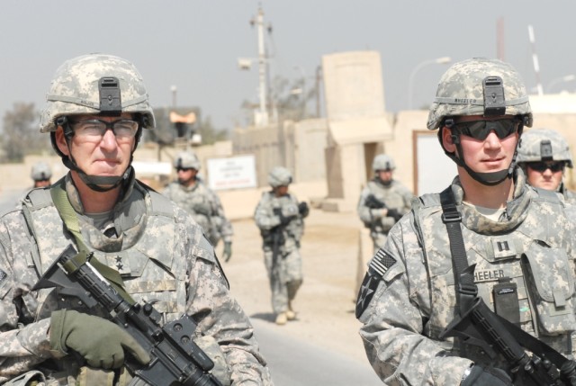 BAGHDAD - Maj. Gen. Daniel Bolger (left), commanding general, 1st Cavalry Division and Multi-National Division-Baghdad and Capt. John Wheeler, commander of Troop C, 1st Squadron 303rd Cavalry Regiment, attached to 1st Sqdn. 124th Cav. Regt., walk dow...