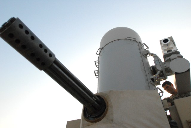 Sonora, Calif. native, Navy Petty Officer 2nd Class Michael Devlin, a Task Force Iron Shield fire control man, with the 2nd Battalion, 44th Air Defense Artillery Regiment, 101st Airborne Division, checks a Phalanx weapon system for any possible...