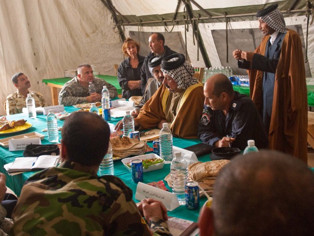 An Iraqi shaykh speaks to Lt. Col. Timothy Daugherty, commander of the 5th Battalion, 82nd Field Artillery Regiment, and other local Iraqi leaders during the Maysan Security Conference at Forward Operating Base Hunter March 10. The Black Dragon...