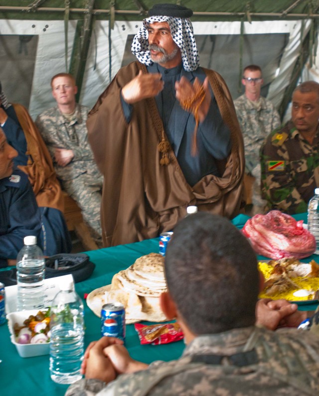 An Iraqi shaykh speaks to Lt. Col. Timothy Daugherty, commander of the 5th Battalion, 82nd Field Artillery Regiment, and other local Iraqi leaders during the Maysan Security Conference at Forward Operating Base Hunter March 10. The Black Dragon...