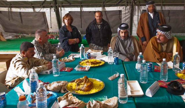 Lt. Col. Timothy Daugherty, commander of the 5th Battalion, 82nd Field Artillery Regiment, responds to a shaykh's concerns during the Maysan Security Conference at Forward Operating Base Hunter March 10. The Black Dragon artillery battalion hosted...