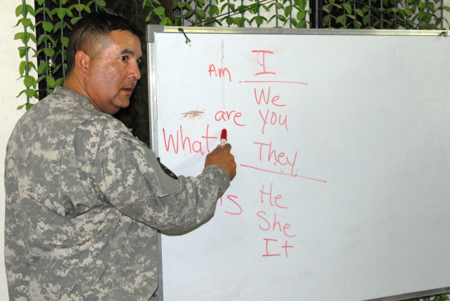 BAGHDAD - Sgt. 1st Class Gabriel Ramirez, Team Weasel, 6th Iraqi Army Division Military Transition Team, gives a basic English class at al Muthana Army Base to Soldiers of 6th IA Div. The class is not a required task for a MiTT team, but Ramirez volu...
