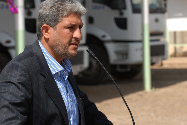 BAGHDAD - Naeem Abaob al-Kaabi, deputy mayor of Baghdad, speaks during a handover ceremony of four Coalition forces funded public works sub-stations at Yarmouk in the Mansour district of Baghdad March 16. In the background sit a few of about 40 publi...