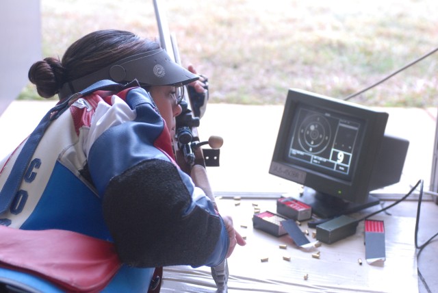 AMU NCO checks her shot