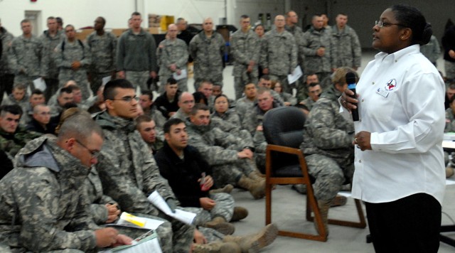 Frances Judkins, an Army Education Services Division guidance counselor, speaks to a group of 15th Sustainment Brigade, 13th Sustainment Command (Expeditionary) Soldiers ranked private to corporal about their educational opportunities at the 180th Tr...