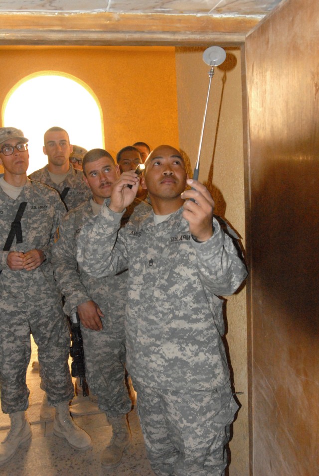 CAMP SLAYER, Iraq -Soldiers from 1st Brigade Combat Team, 1st Cavalry Division learn proper techniques for entering a room during the Tactical Site Exploitation search class given by the Counter-Improvised Explosive Device training team March 10. ...