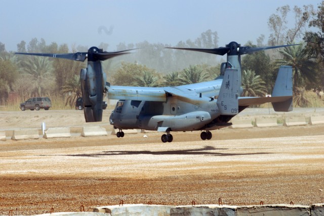 CAMP LIBERTY, Iraq - Like a helicopter, a Marine Corps MV-22B Osprey aircraft hovers over the Liberty Command Pad prior to touching down March 19 on Camp Liberty. Shortly after landing, the aircraft off-loaded a few Marines who were visiting...