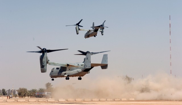 CAMP LIBERTY, Iraq - Two U.S. Marine Corps MV-22 B Osprey tilt-rotor aircraft take off from Liberty Command Pad March 19. When it comes to how it flies, the Osprey combines the best of both worlds with the ability to take off and land like a...