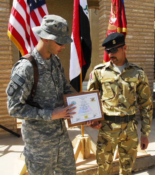 BAGHDAD - Capt. Allan Carroll, of Kailua, Hawaii, and commander of Company B, 1st Battalion, 35th Armor Regiment, Task Force 4th Battalion, 27th Field Artillery Regiment, 2nd Brigade Combat Team, 1st Armored Division, Multi- National Division-Baghdad...