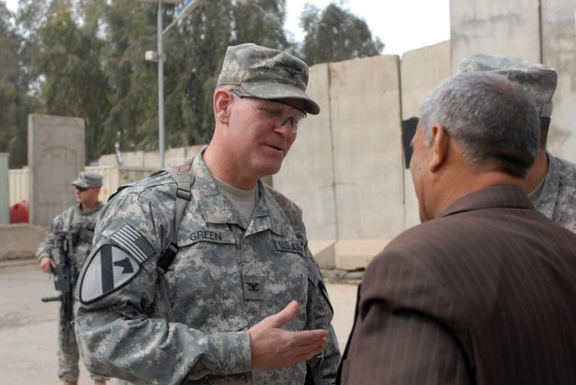 CAMP WAR EAGLE, Iraq - Sioux Falls, S.D. native, Col. Tobin Green (left), commander of the 1st "Ironhorse" Brigade Combat Team, 1st Cavalry Division talks about future plans in partnering  with Iraqi Security Forces and the Government of Iraq...