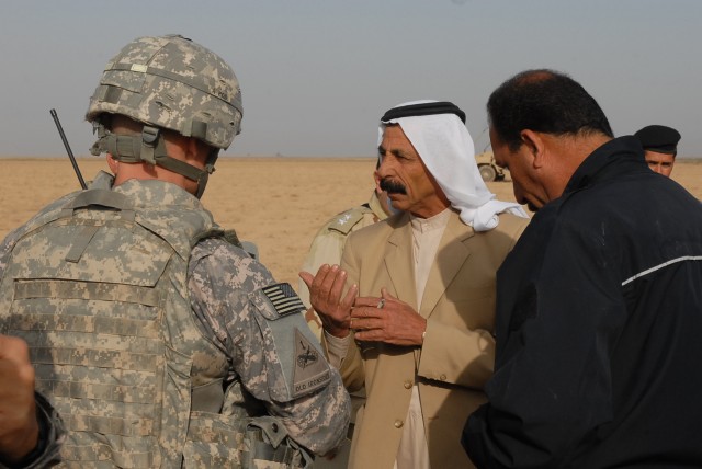 Lt. Col. Andy Shoffner, of Harker Heights, Texas, the commander of 4th Squadron, 9th Cavalry Regiment, 2nd Brigade Combat Team, 1st Cavalry Division, and Iraqi Police Brig. Gen. Sarhad, the police chief for the rural areas in the region, speak...