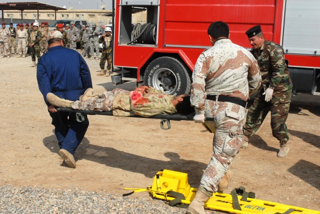 Participants of the combat life saver course at Kirkuk Military Base in Kirkuk, Iraq, take part in a mass casualty training exercise Feb. 24. The participants came from various backgrounds, and are going through the course to learn vital life...
