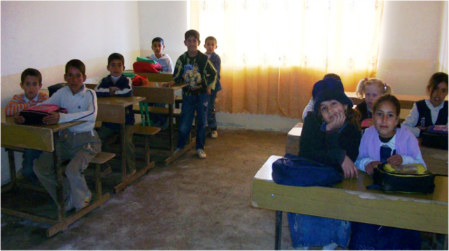 Iraqi schoolchildren attend the Al Athabiah Primary School in Riyadh, Iraq, March 2, after recent renovations to the school were complete. The school renovations were part of a project called the Riyadh Public Works Civil Service program which...