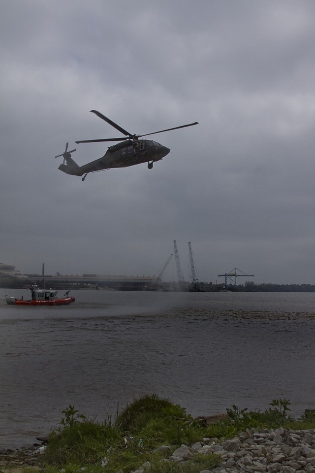 With the Coast Guard present, a UH-60 Black Hawk helicopter from 3rd Assault Helicopter Battalion, 227th Aviation Regiment, 1st Air Cavalry Brigade, 1st Cavalry Division, makes its approach to land at the Port of Beaumont, Texas, March 17. The...