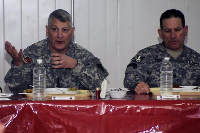 BAGHDAD - General Carter Ham, (left) commanding general of U.S. Army Europe sits with Command Sgt. Maj. Ralph Beam, USAREUR command sergeant major, while answering a question from a Soldier from 2nd Brigade Combat Team, 1st Armored Division, Multi-Na...