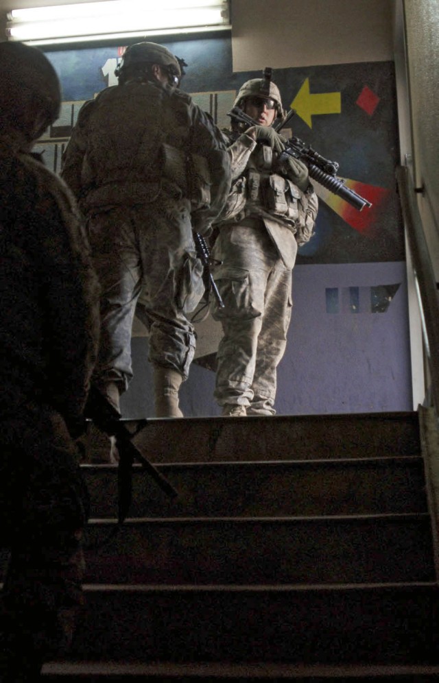 Soldiers with C Company, 1st Battalion, 67th Armor Regiment, 2nd Brigade Combat Team, 4th Infantry Division maneuver a staircase in the Alsalam Hospital in Mosul, Iraq. The windows of the hospital were damaged in an improvised explosive device detona...