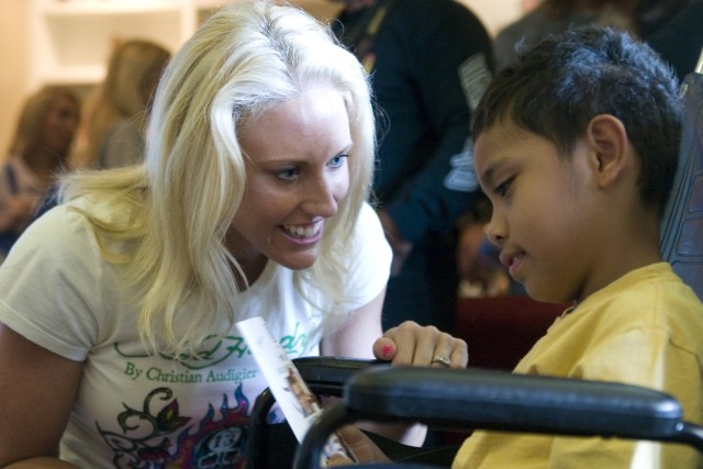 Television celebrities visit Fisher House before basketball game