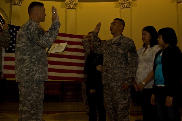 As members of his family watch in proud admiration, Staff Sgt. Jeffrey Capalar, from Crystal Lake, Ill., battalion retention noncommissioned officer, Headquarters Support Company, 615th Aviation Support Brigade, 1st Air Cavalry Brigade, 1st...