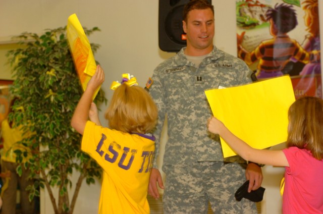 Capt. Tyler Stegeman, Rear Detachment commander of 1st Battalion, 5th Cavalry Regiment, 2nd Brigade Combat Team, 1st Cavalry Division, of Jefferson City, Mo., congratulates Duncan Elementary School students for being selected as the Texas State...