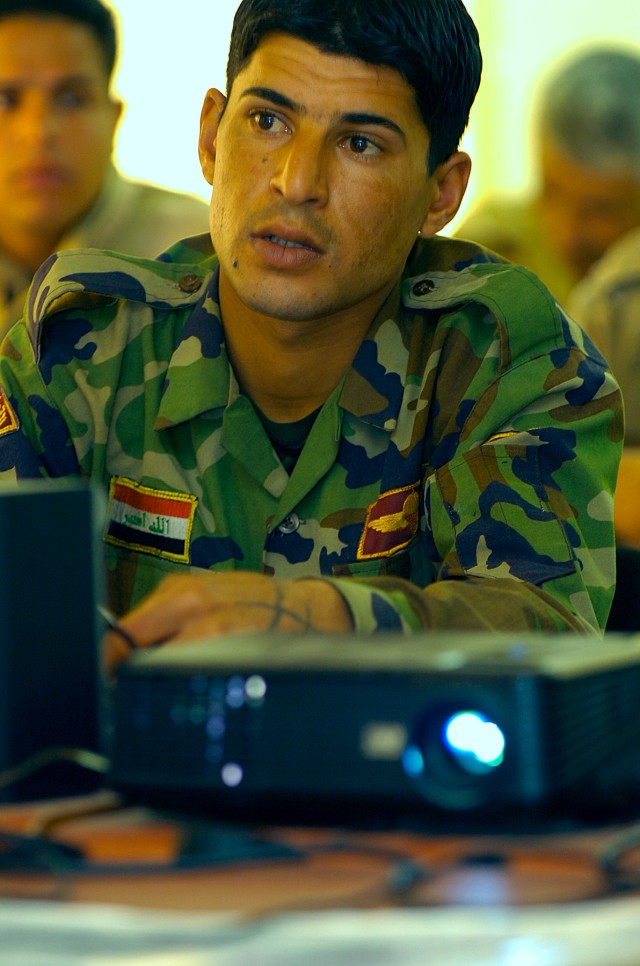 BAGHDAD-An Iraqi Army jundi takes notes from a slide on how to read and identify defining features on a map, such as bodies of water and man made objects. This class, held March 22 at the 11th Iraqi Army Division's Non Commissioned Officer's Academy,...