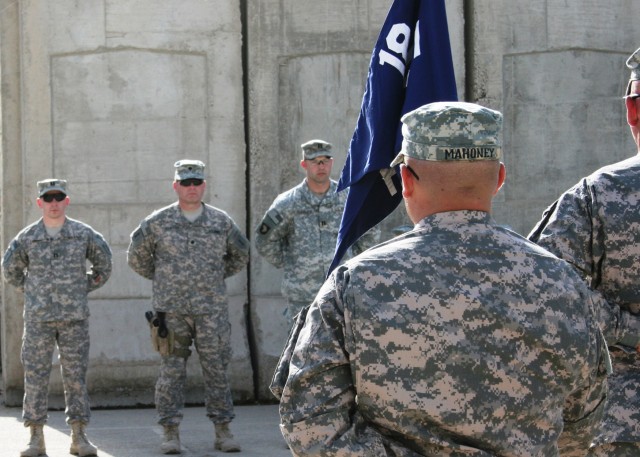 BAGHDAD -The official party for the change of command ceremony of Headquarters and Headquarters Company, 1st Combined Arms Battalion, 18th Infantry Regiment, stand in formation at Forward Operating Base Justice March 19. During the change of command ...