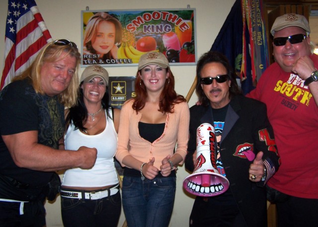BAGHDAD - (From left to right) Greg "the Hammer" Valentine, Traci Brooks, "SoCal Val," Jimmy "Mouth of the South" Hart and Brian "Nasty Boy" Knobs, members of the "Legends of Wrestling Tour," pose for a photo at the Headquarters of the 1st...