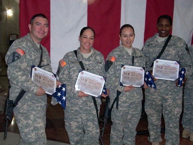 (left to right) Spc. Eduardo Reyes, from Guayaquil, Ecuador, Spc. Rosemarie Narvaez, from Subic-Zambales, Phillipines, Pfc. Dianne Hurtado, from Quito, Ecuador, and Pfc. Grace Wanjie, from Nairobi, Kenya, Soldiers with 27th Brigade Support...