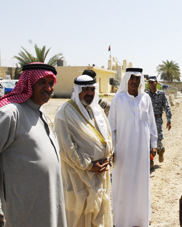 Sheik leaders await the arrival of 22 former Iraqi detainees at Joint Security Station, Doura, in southern Baghdad, March 27. After the detainees arrived, they were processed through the Iraqi National Police and local sheiks signed paperwork...