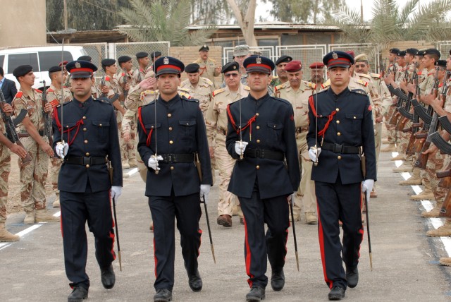 BAGHDAD - Iraqi Military Academy - Rustamiyah cadets line the walkway as their fellow students lead VIPs into the ceremony to transfer Forward Operating Base Rustamiyah back over to Iraqi officials here March 31. Some of the dignitaries include: Maj....