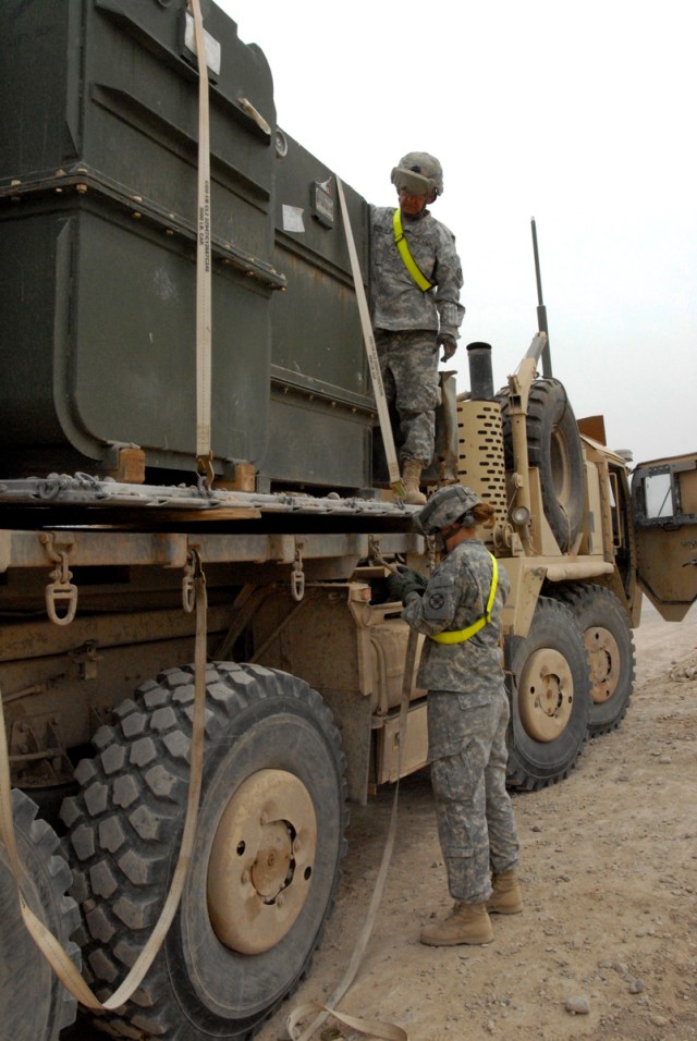 CAMP LIBERTY, Iraq - Cpl. Mark Harrington, from Brockton, Mass., and Spc. Laura Boxley from Belton, Mo., both truck drivers with the 154th transportation company, 553rd Combat Sustainment Support Battalion, 10th Sustainment Brigade, 3rd...