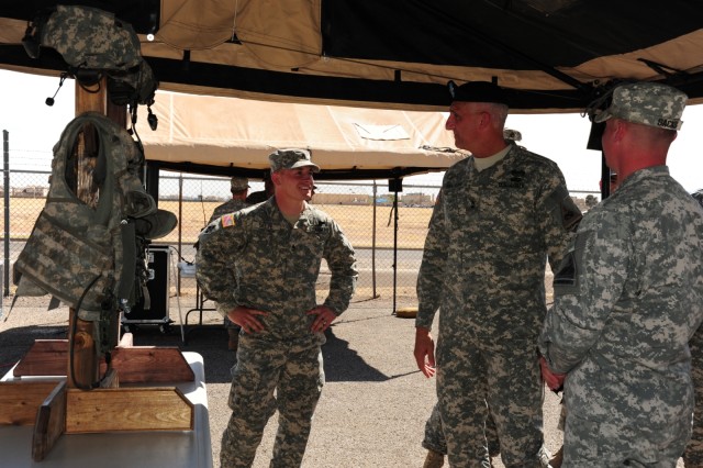 Staff Sgt. Joshua Selfe briefs Maj. Gen. Hertling on the Land Warrior system