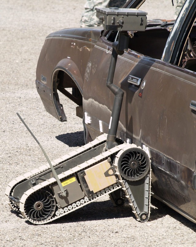 The Small Unmanned Ground Vehicle (SUG-V) performs a vehicle inspection