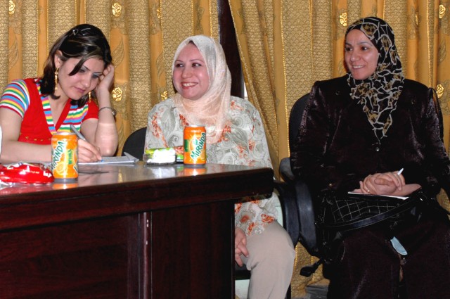 BAGHDAD - Members of the Neighborhood Advisory Council revel in the improvements already made in their community that provide more security and more essential services to improve the quality of life for the people of Iraq during the NAC meeting ...