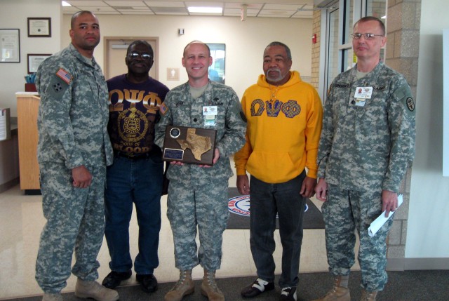 Omicron Pi Chapter Presents Plaque to Robertson Blood Center Director