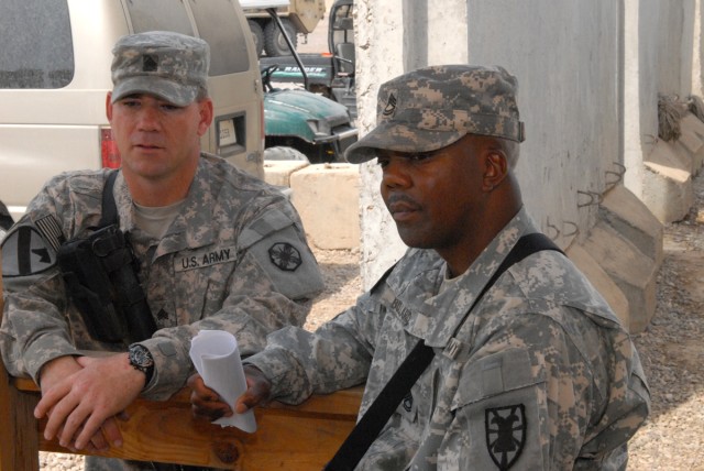 CAMP LIBERTY, Iraq - Soldiers discuss right seat and left seat rides here, April 1, as a relief in place and transfer of authority from the 154th Transportation Co. to the 89th Transportation Co. takes place.  Sgt. Timothy O'hara, from Victoria,...