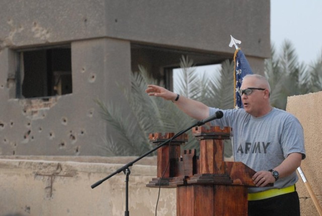 BAGHDAD -1st Sgt. David Roman, A Company, 46th Engineer Combat Battalion (Heavy), 225th Engineer Brigade, of Holland Patent, N.Y., describes the battle scene that fateful night six years ago before the run honoring Sgt. 1st Class Paul R. Smith...