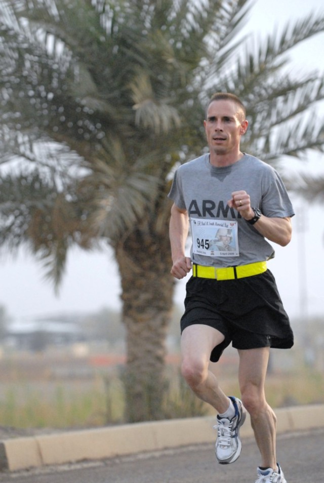 BAGHDAD - Lt. Col. Brian Foley, of Blackstone, Mass., commander of the 50th Signal Battalion from Fort Bragg, N.C., wins the 11.46 km Sgt. 1st Class Paul R. Smith Memorial Run in a commanding time of  44:08 on Victory Base Complex, April 5. The...