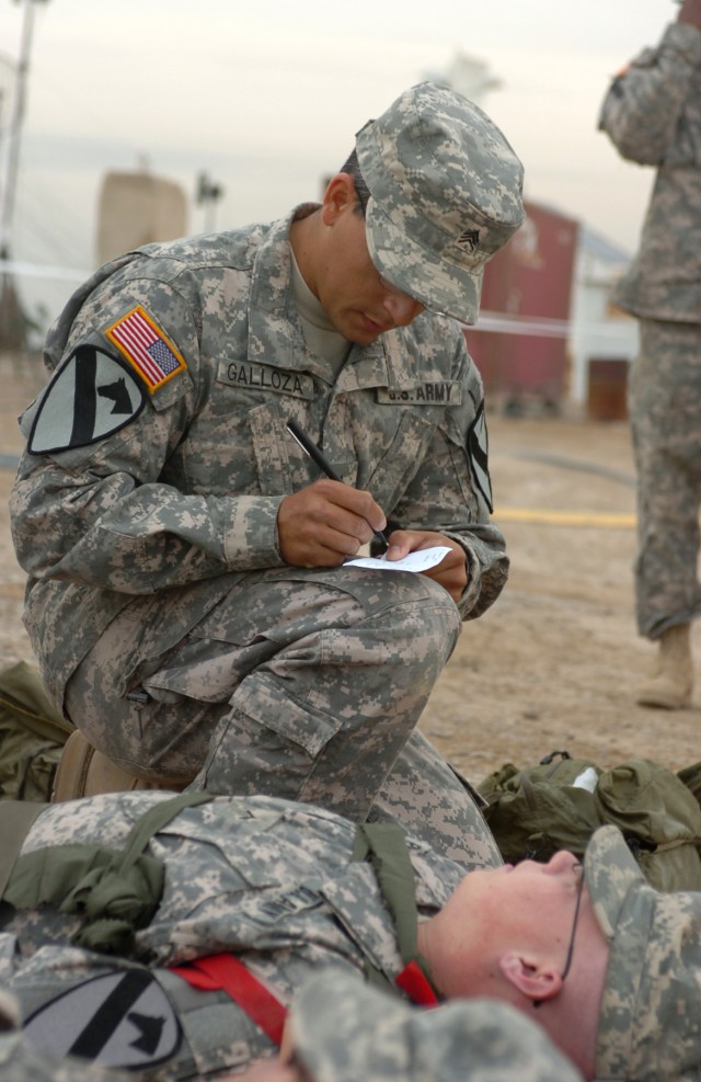 CAMP LIBERTY, Iraq - During a mass casualty exercise at Camp Liberty, Iraq, Aguada, Puerto Rico native, Sgt. Benito Galloza, a radio maintainer/operator with Company C, Division Special Troops Battalion, 1st Cavalry Division, writes down...