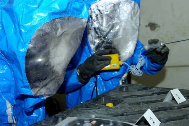 Soldiers from Chemical, Biological, Radiological, and Nuclear Plt., Headquarters and Headquarters Company, 3rd Heavy Brigade Combat Team, 1st Cavalry Division, analyze materials found in a mock contaminated area during a hands on chemical,...